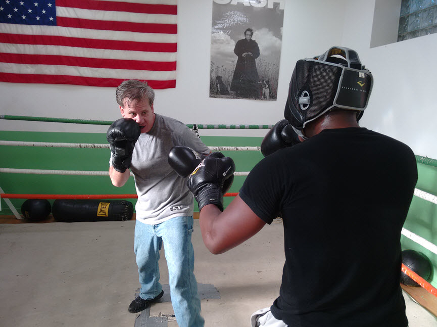 Mike Joyce spars with trainee Gregory George.